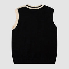 Suéter tipo chaleco a cuadros con bordado de oso