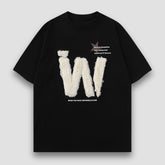 Camiseta con letras bordadas