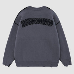 Pullover mit Vintage-Kreuzmuster und Stickerei