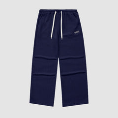 Pantalones lisos con estampado de gofres y letras bordadas