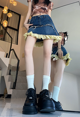 Falda vaquera degradada con paneles con volantes