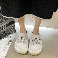 Zueco de jardín con carita sonriente