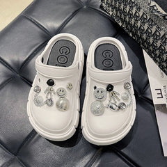 Zueco de jardín con carita sonriente