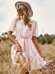 Vestido de lunares rosas de manga corta con cintura alta