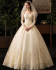 Brautkleid mit langen Ärmeln und Knotendetail aus Spitze