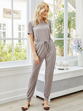 Pure color hem waist tie-up casual short-sleeved comfortable jumpsuit