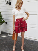 Falda corta con lunares blancos