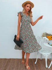 Vestido floral con escote en V y mangas abullonadas