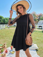 Vestido de cuello redondo y manga larga con aberturas