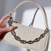 Bolso de mano con estampado de cocodrilo que combina con todo