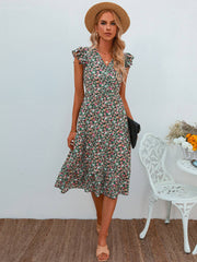 Vestido floral con escote en V y mangas abullonadas