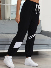 Pantalones cónicos de cintura sólida