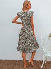 Vestido floral con escote en V y mangas abullonadas