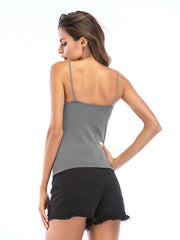 Top ajustado con espalda descubierta y lazo con tirantes blancos