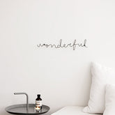 Colgante de pared cursivo