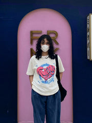 Camiseta holgada de cuello redondo y manga corta con estampado de letras