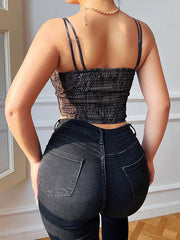 Chaleco pequeño con parte superior de encaje con tirantes cruzados en el pecho y espalda abierta