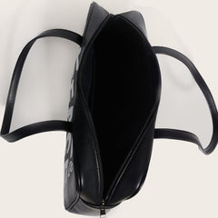 Bolso cuadrado pequeño con un solo hombro y estampado en blanco y negro