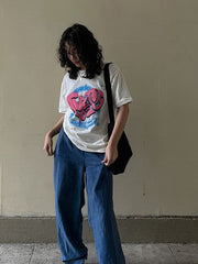 Camiseta holgada de cuello redondo y manga corta con estampado de letras