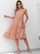 Vestido floral con escote en V y mangas abullonadas