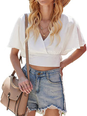 Top corto con cuello en V, mangas de muñeca y lazo en la espalda