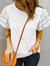 Top casual con cuello redondo y color liso