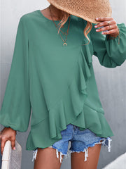 Top irregular con mangas farol y volantes de color liso