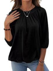 Camiseta holgada de color liso con cuello redondo y manga media