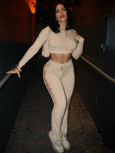 Conjunto de top de manga larga con cuello redondo y pantalones ajustados con aberturas