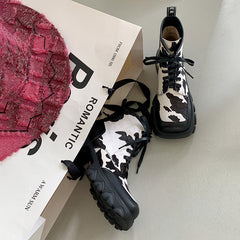 Botas con plataforma Nori y estampado de vaca