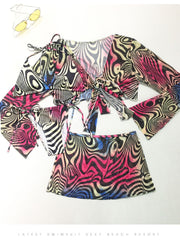 Traje de baño de 4 piezas con estampado, top y falda