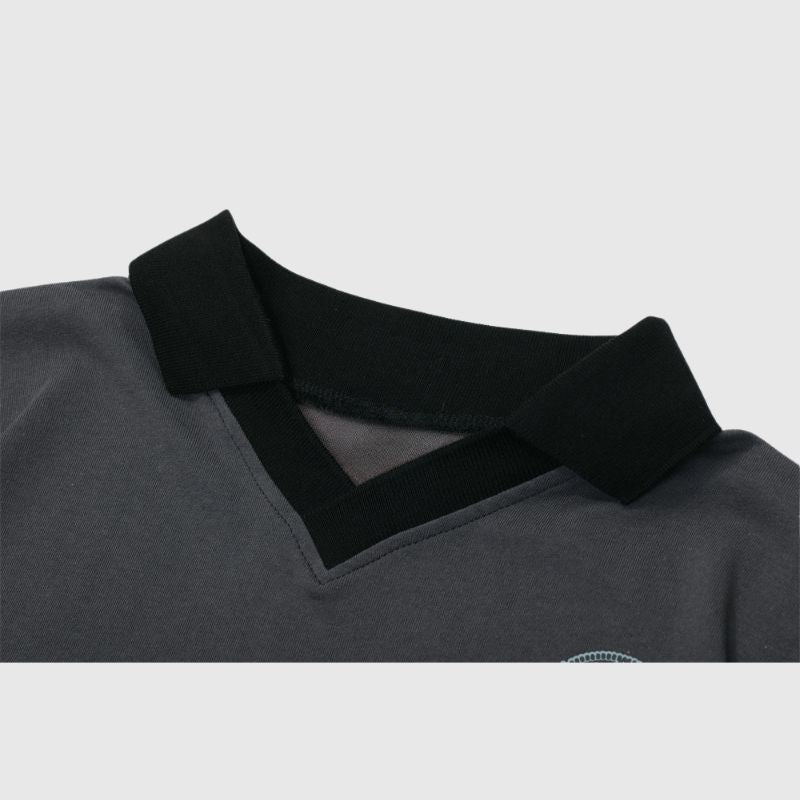 Camiseta polo con parche de medalla