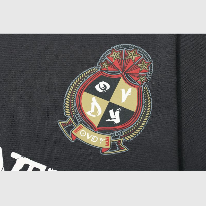 Camiseta polo con parche de medalla