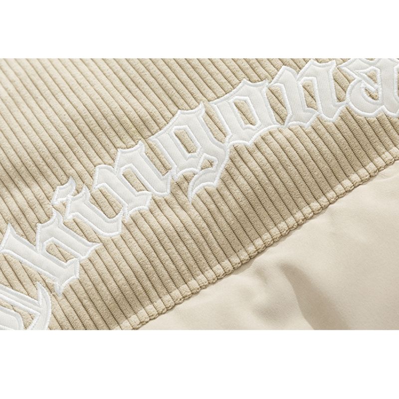 Chaqueta de pana con patchwork y letras bordadas