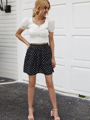Short skirt with white spots