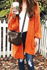 Lockere, lange orange Strickjacke