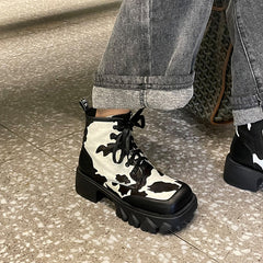 Nori Platform Cow Print Boots